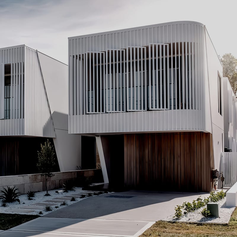 Street front of the duplex with landscaped gardens, a pool, two homes side by side and Luke Parker Sydney Swans, Lawson White in Matraville
